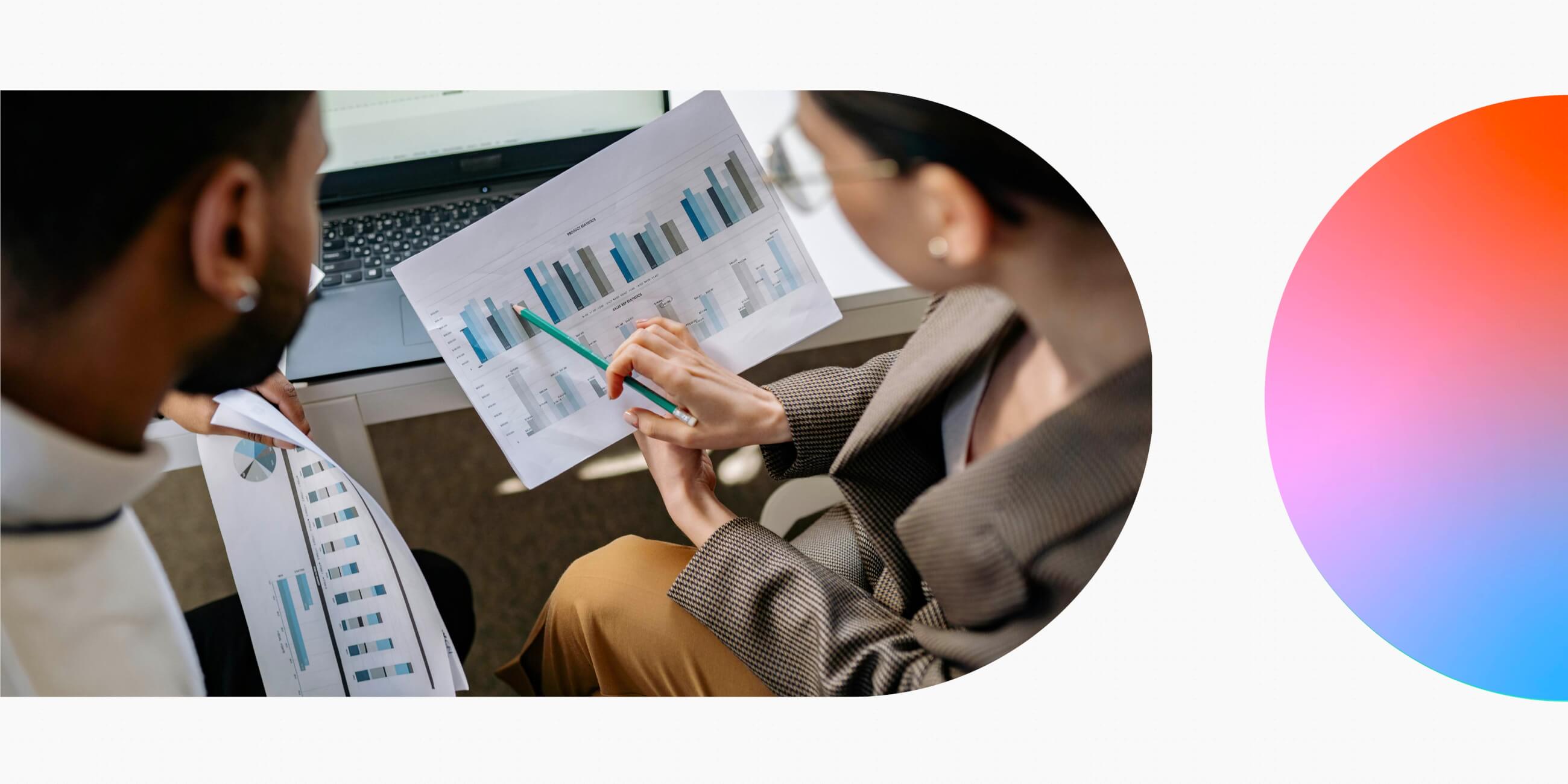Two UX professionals analysing research data.