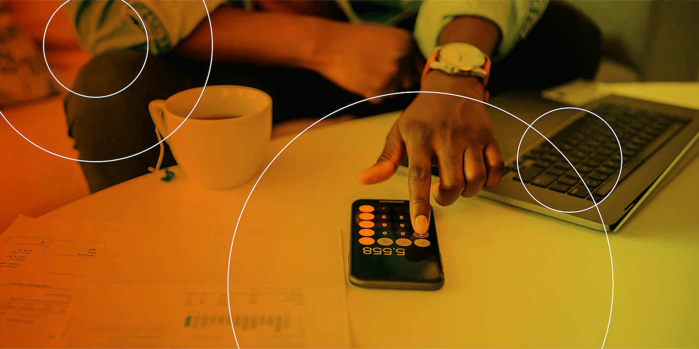 A person typing in numbers on a calculator.